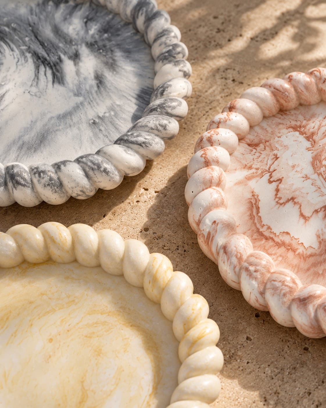 Close-up of the rope-edge detail across the Arivo tray collection